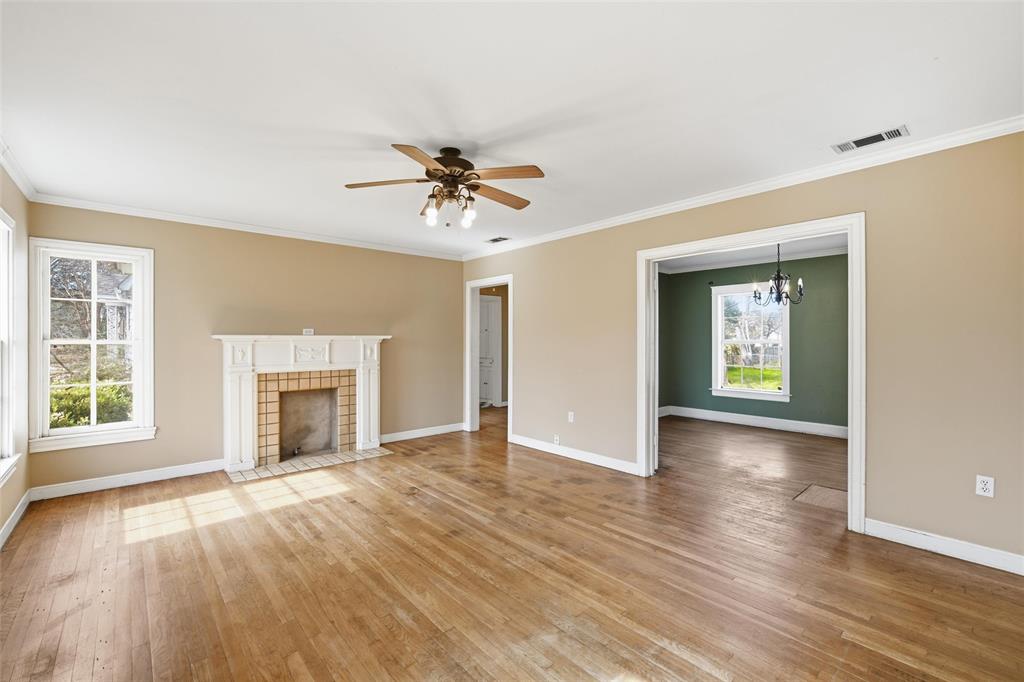 3005 Windsor Avenue Waco, TX 76708 - Photo 4 of 37 a view of an empty room with a fireplace and a window