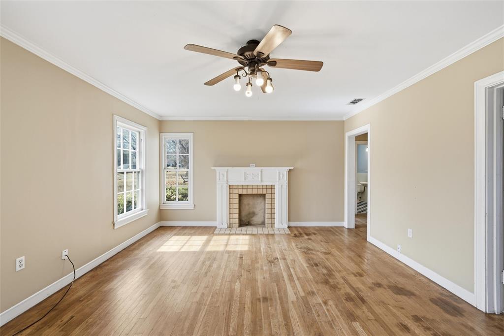 3005 Windsor Avenue Waco, TX 76708 - Photo 5 of 37 a view of an empty room with window and wooden floor