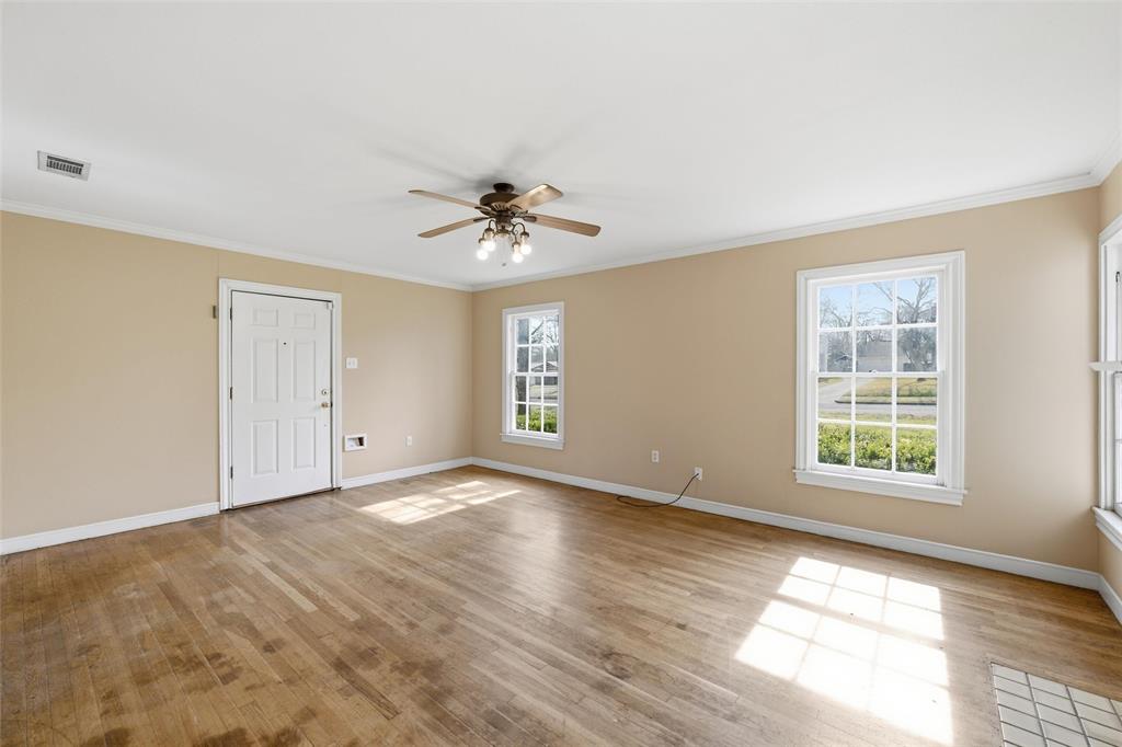 3005 Windsor Avenue Waco, TX 76708 - Photo 7 of 37 wooden floor in an empty room with a window
