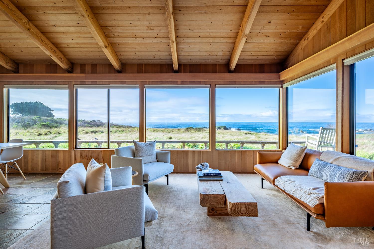 336 Pipers Reach The Sea Ranch, CA 95497 - Photo 2 of 15 a living room with furniture and floor to ceiling windows