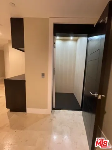 a view of a large building with a mountain in the background