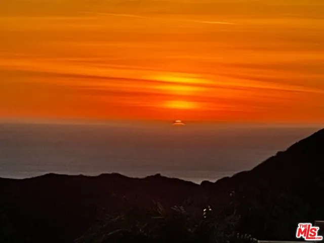 a view of ocean and mountains