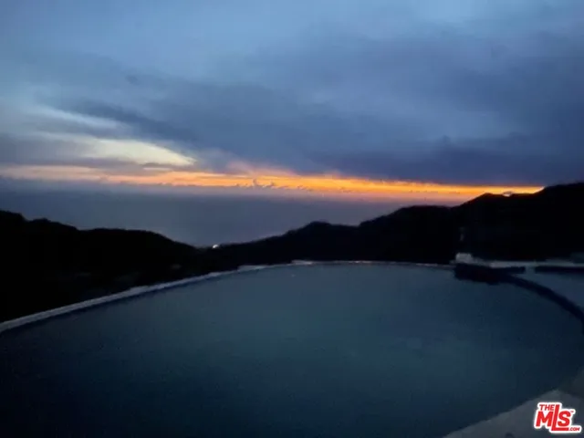 a view of roof deck with furniture