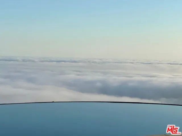 an aerial view of house with yard