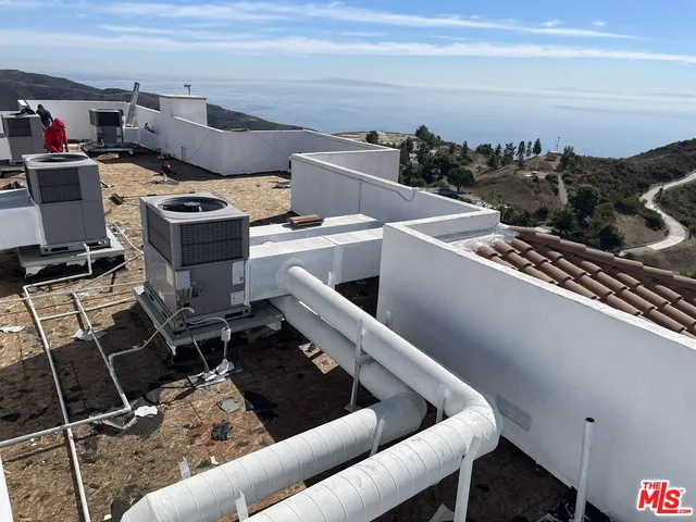 a view of a backyard of the house