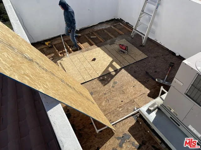 a view of a balcony with wooden floor