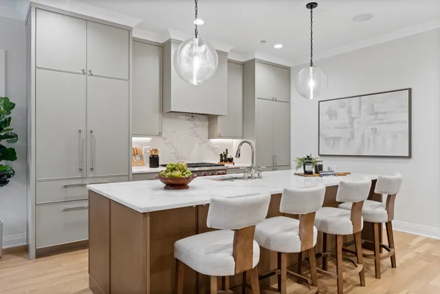 a large kitchen with a table and chairs