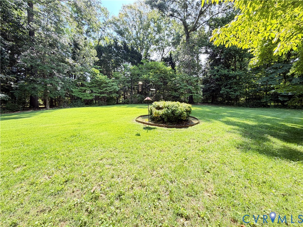 3933 Dunraven Road North Chesterfield, VA 23236 - Photo 8 of 30 a view of a big yard with a small yard