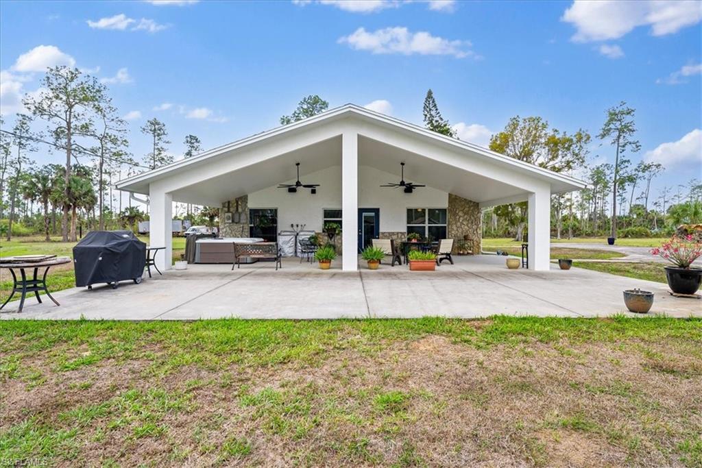 6070 Lee Williams Road Naples, FL 34117 - Photo 22 of 26 a view of a garden with patio
