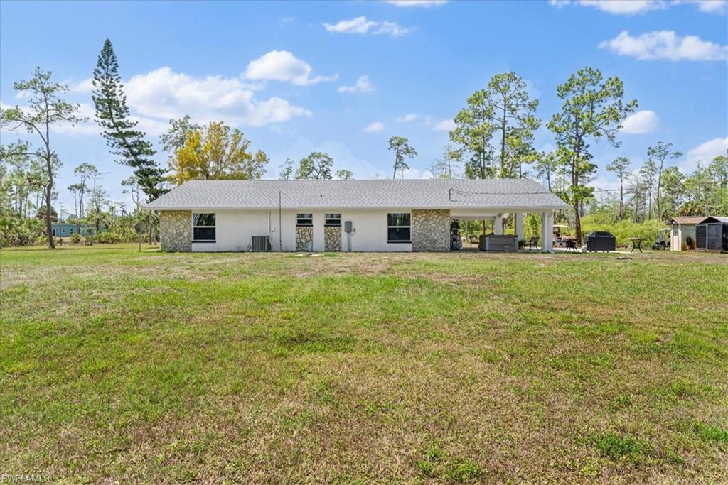 6070 Lee Williams Road Naples, FL 34117 - Photo 25 of 26 a view of a house with a big yard