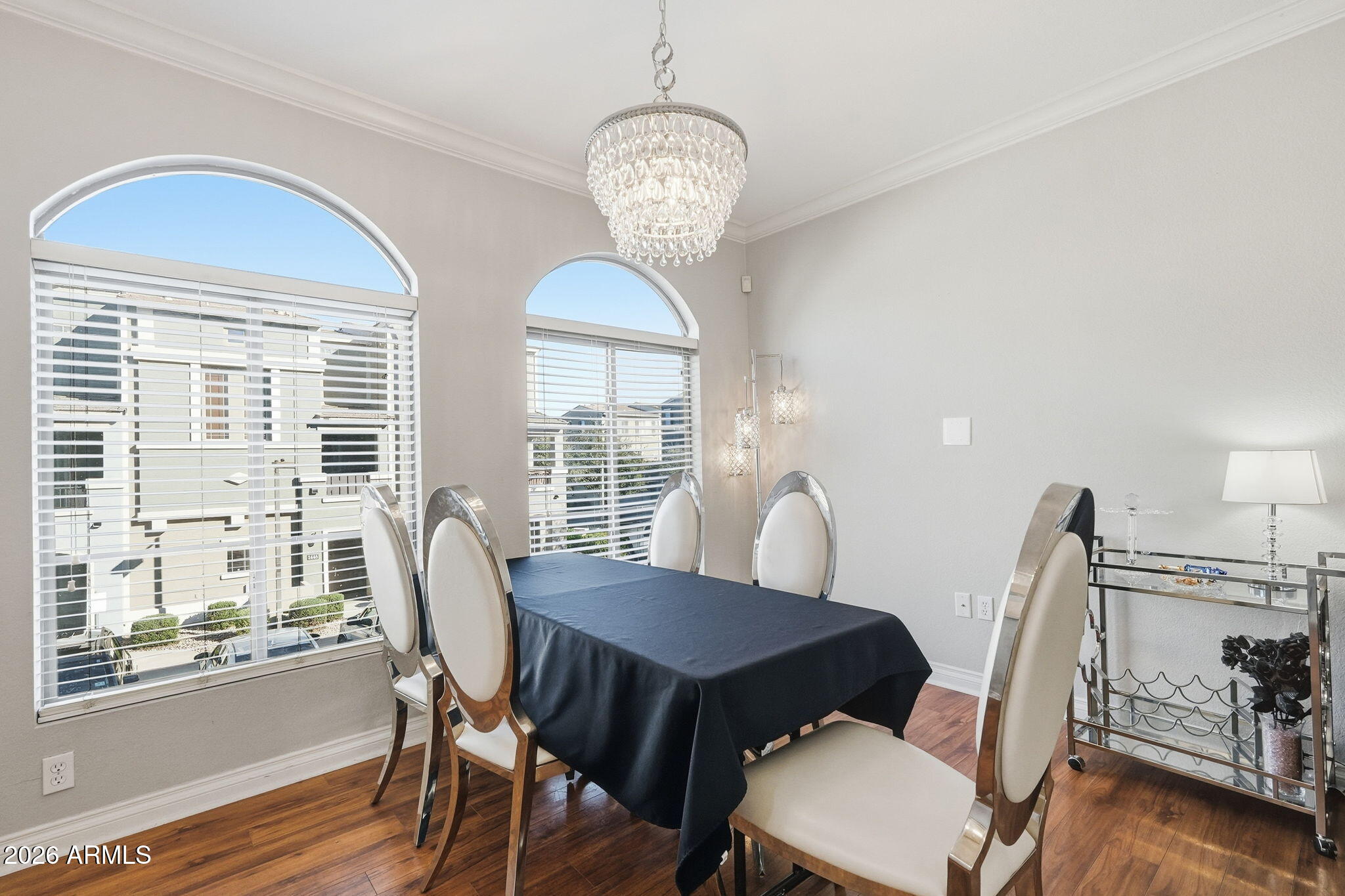 2402 East 5th Street, Unit 1409 Tempe, AZ 85288 - Photo 11 of 34 a view of a dining room with furniture window and wooden floor