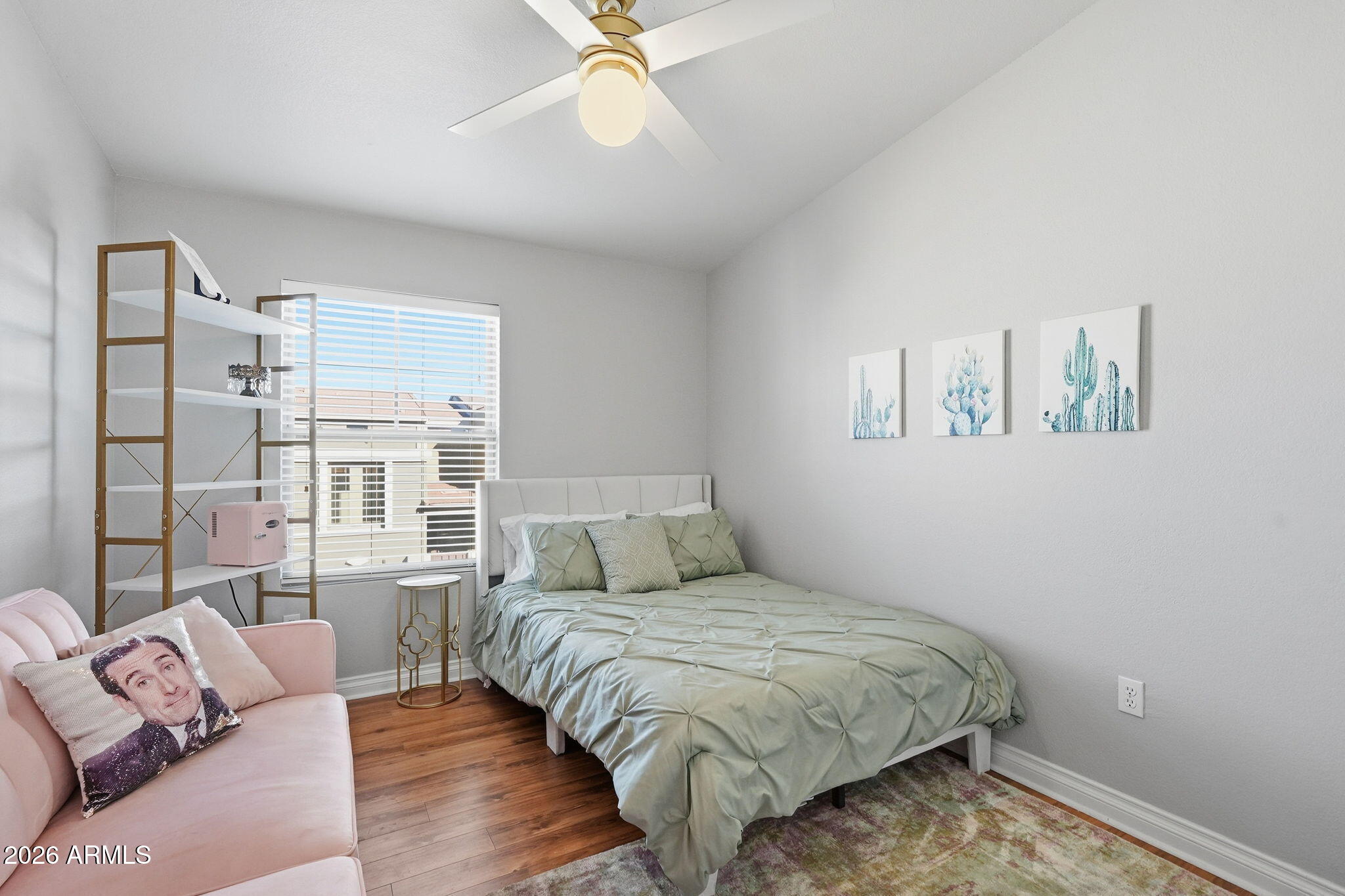 2402 East 5th Street, Unit 1409 Tempe, AZ 85288 - Photo 17 of 34 a bedroom with a large bed and a couch