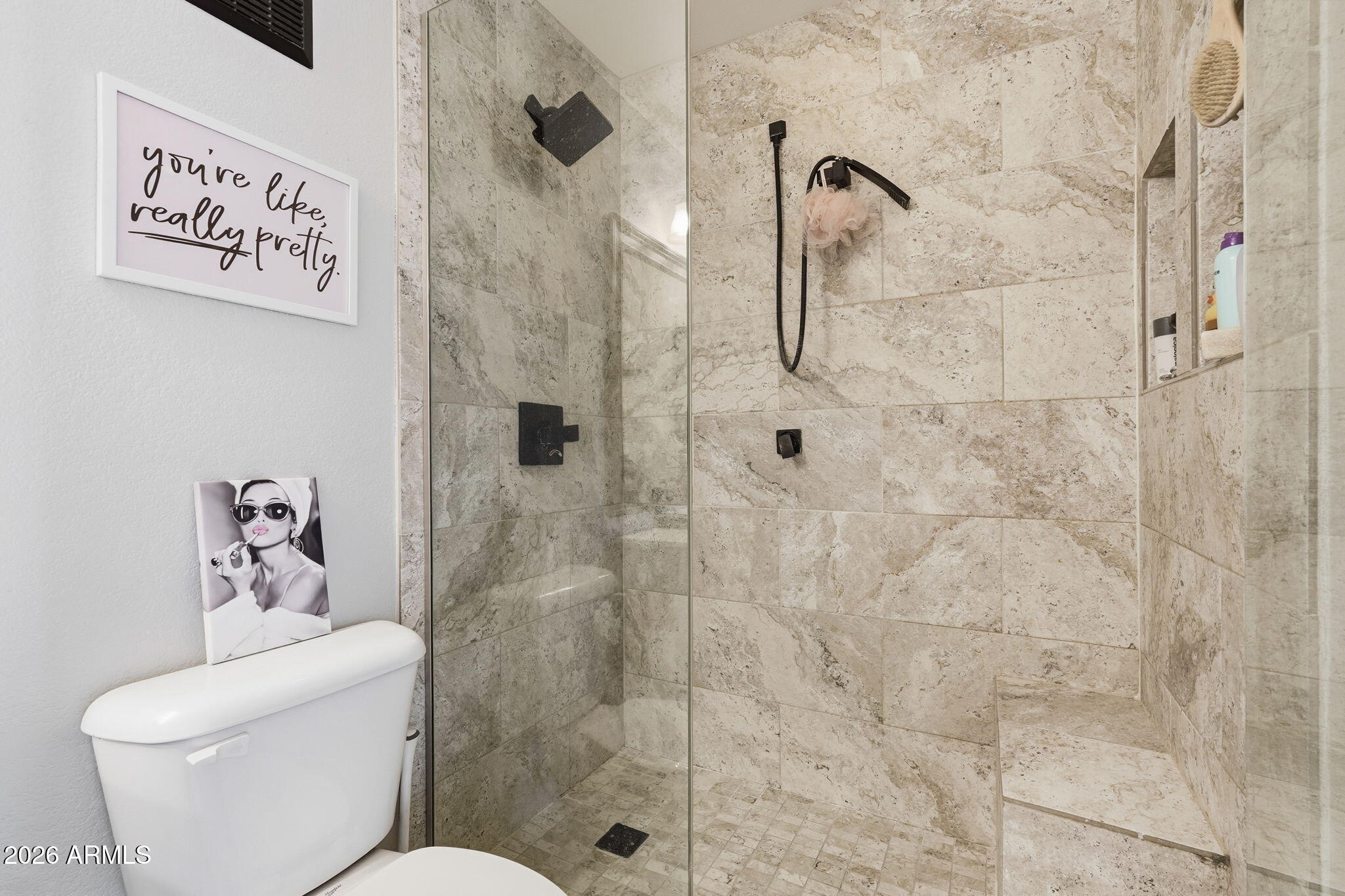 2402 East 5th Street, Unit 1409 Tempe, AZ 85288 - Photo 19 of 34 a white toilet sitting next to a bathroom shower