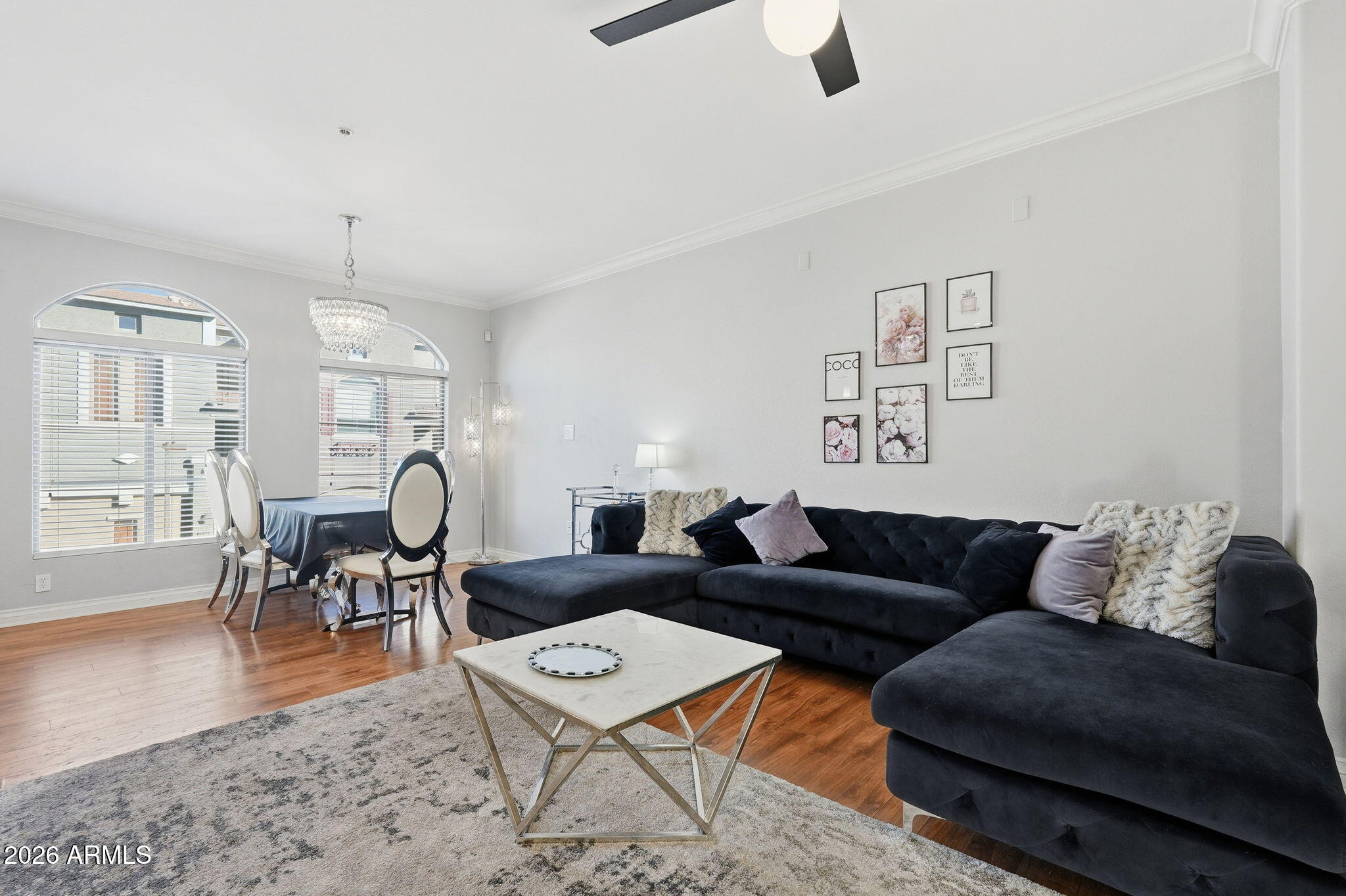 2402 East 5th Street, Unit 1409 Tempe, AZ 85288 - Photo 2 of 34 a living room with furniture and wooden floor