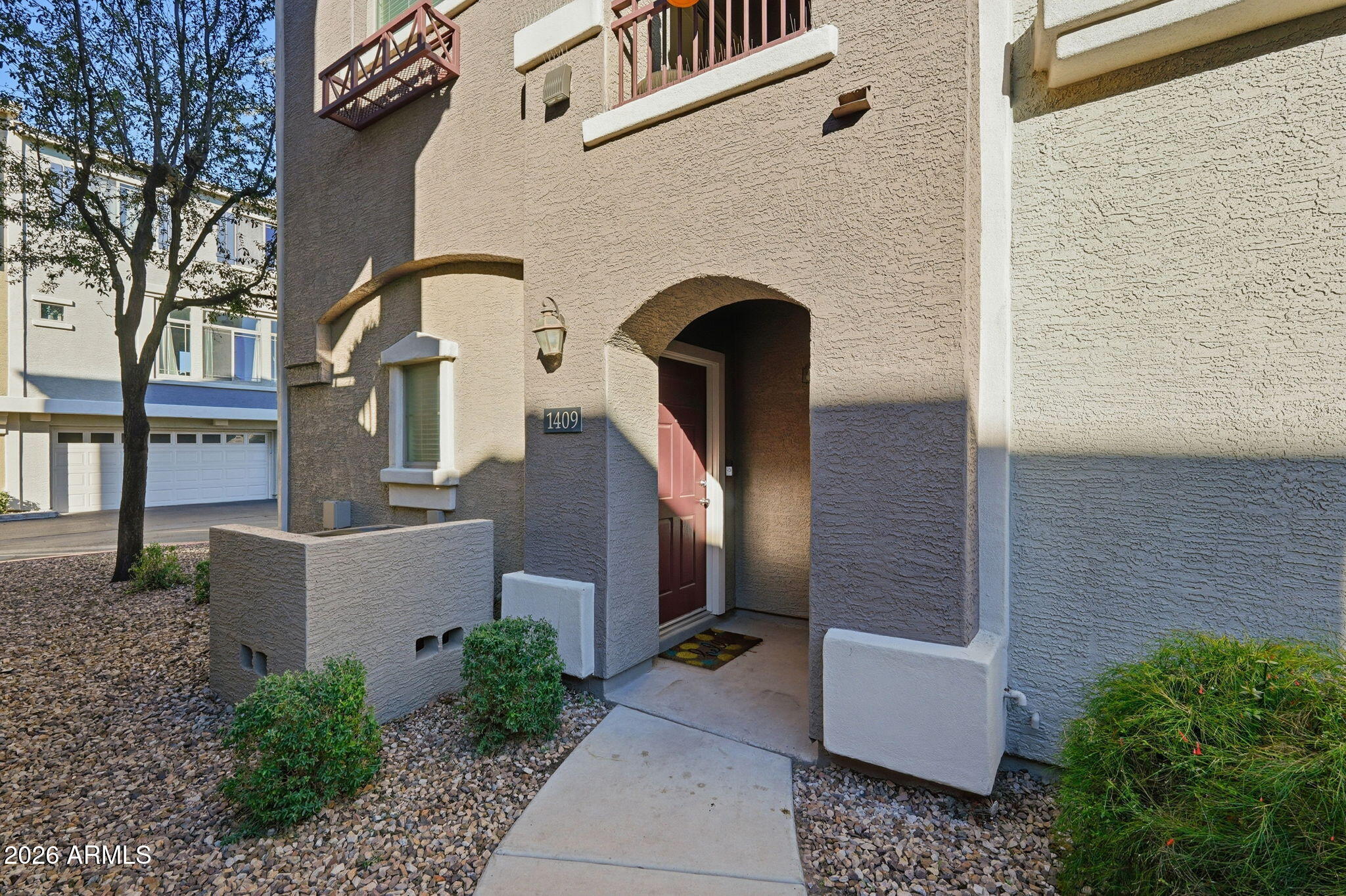 2402 East 5th Street, Unit 1409 Tempe, AZ 85288 - Photo 29 of 34 a front view of a house with stairs