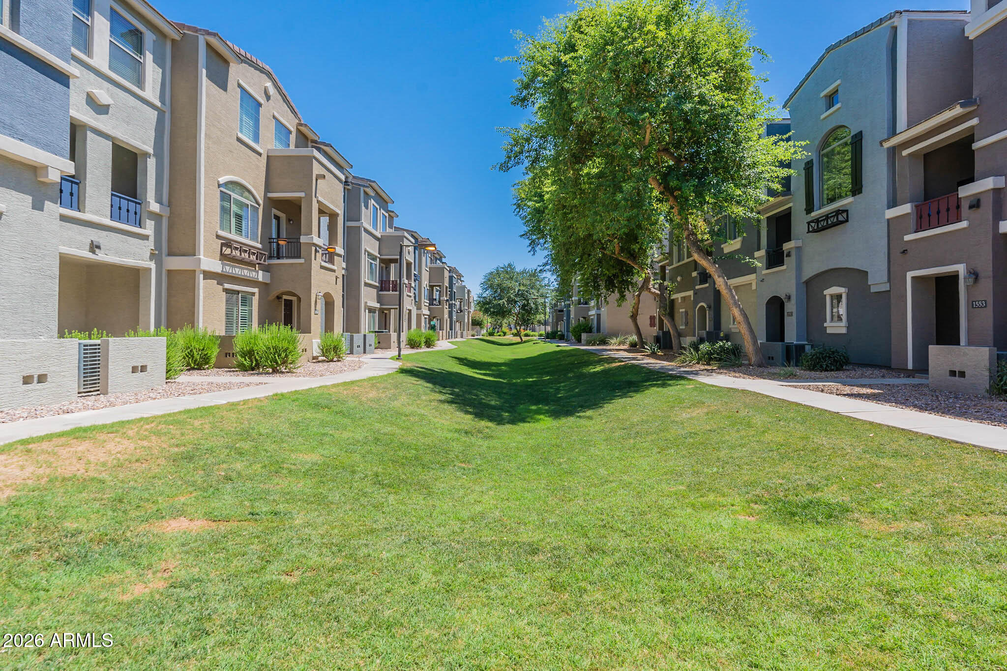 2402 East 5th Street, Unit 1409 Tempe, AZ 85288 - Photo 32 of 34 a view of a building with a yard
