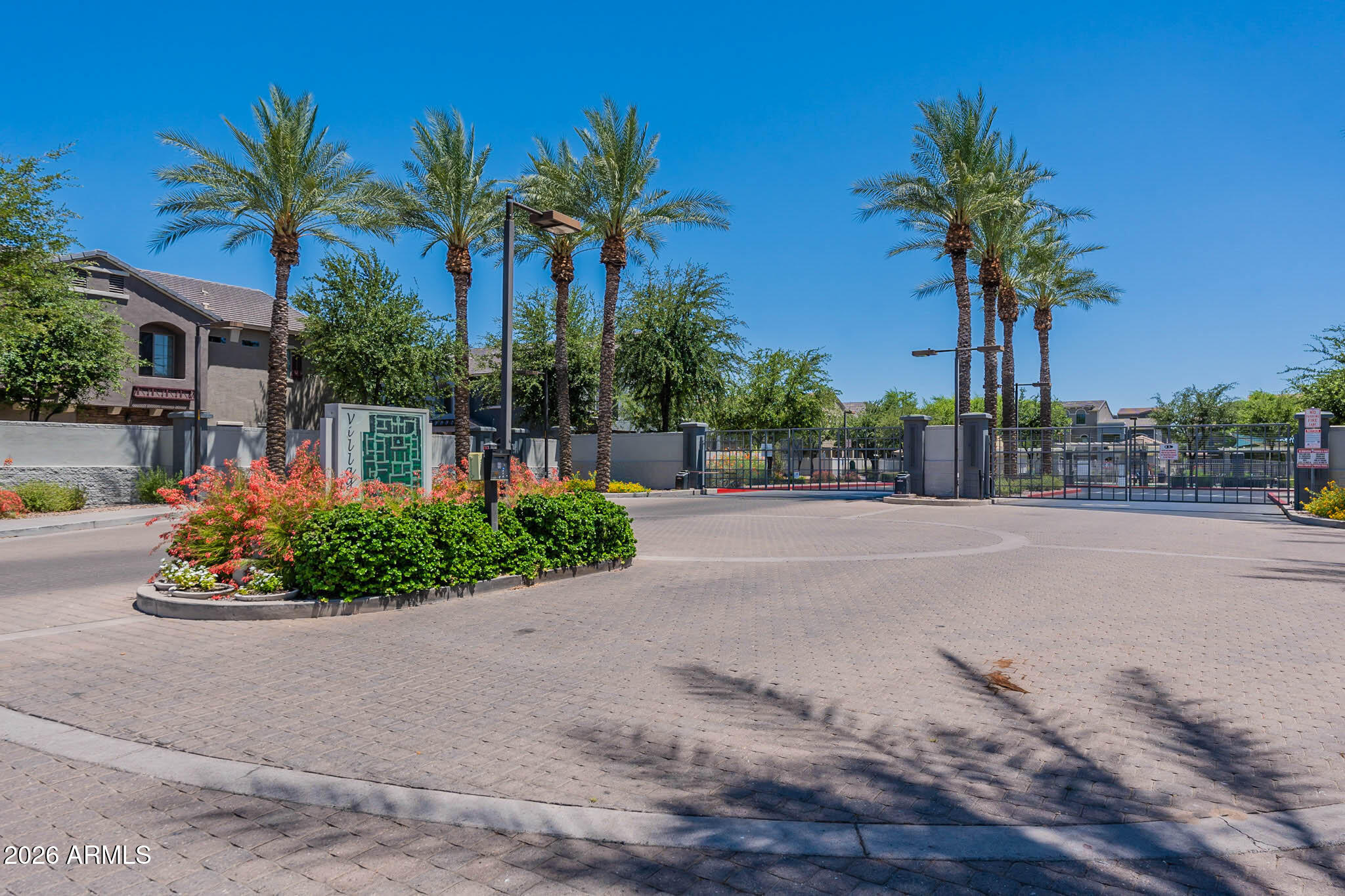 2402 East 5th Street, Unit 1409 Tempe, AZ 85288 - Photo 34 of 34 a front view of multi story residential apartment building with a garden and plants