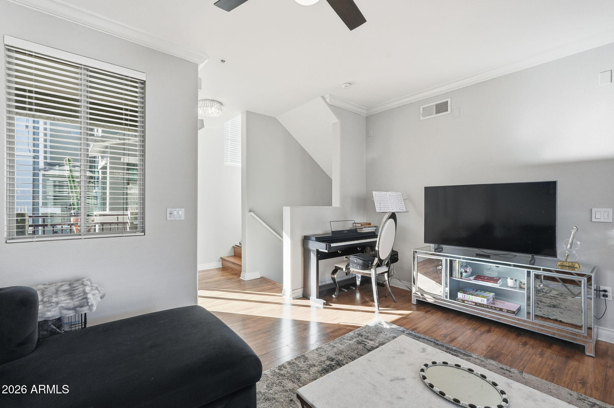 2402 East 5th Street, Unit 1409 Tempe, AZ 85288 - Photo 4 of 34 a living room with furniture and a flat screen tv