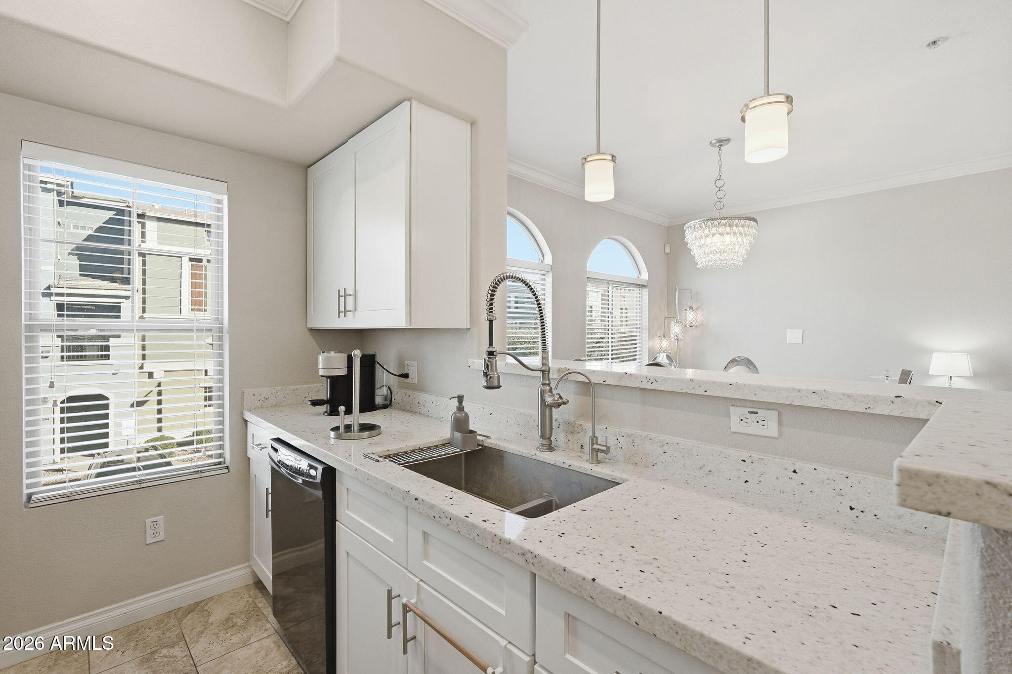 2402 East 5th Street, Unit 1409 Tempe, AZ 85288 - Photo 8 of 34 a kitchen with a sink dishwasher and a stove with wooden floor