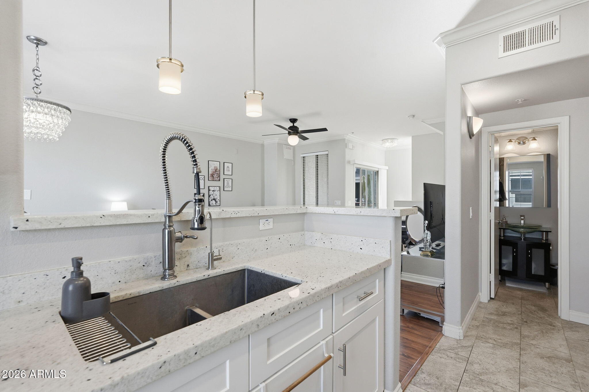 2402 East 5th Street, Unit 1409 Tempe, AZ 85288 - Photo 9 of 34 a kitchen with a sink and a refrigerator