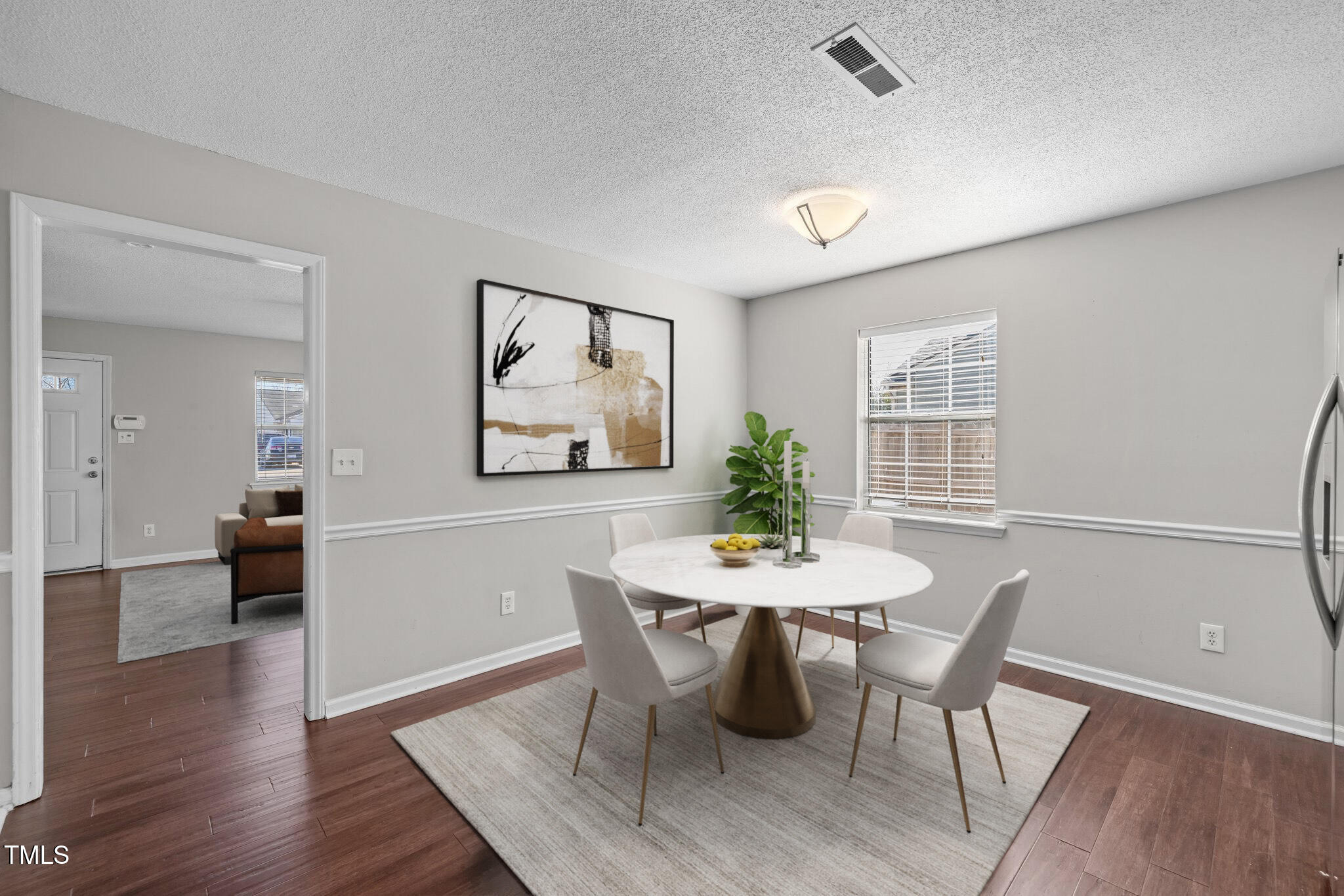 4104 Ludgate Drive Durham, NC 27713 - Photo 13 of 46 a view of a dining room with furniture and wooden floor