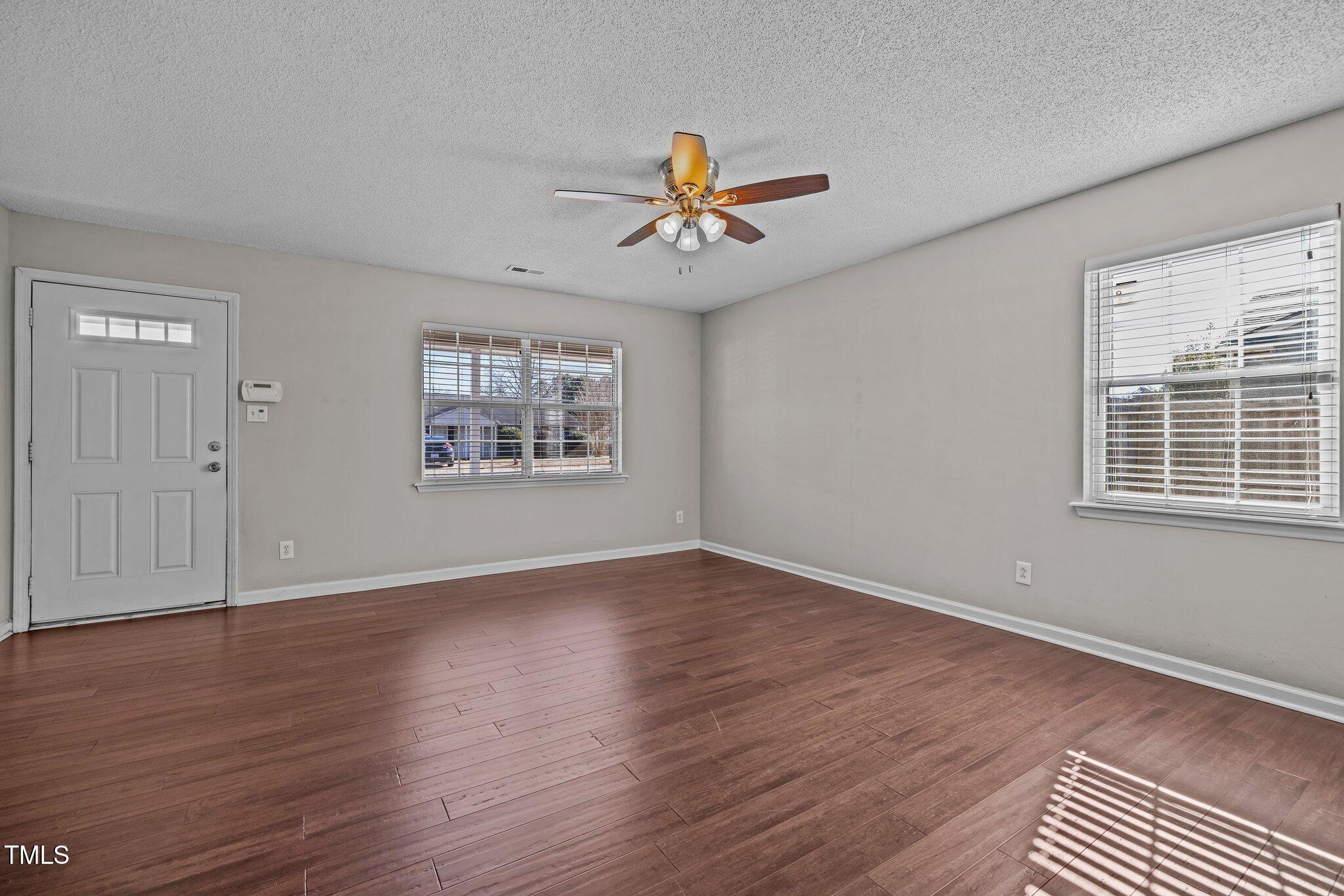 4104 Ludgate Drive Durham, NC 27713 - Photo 16 of 46 wooden floor in an empty room with a window