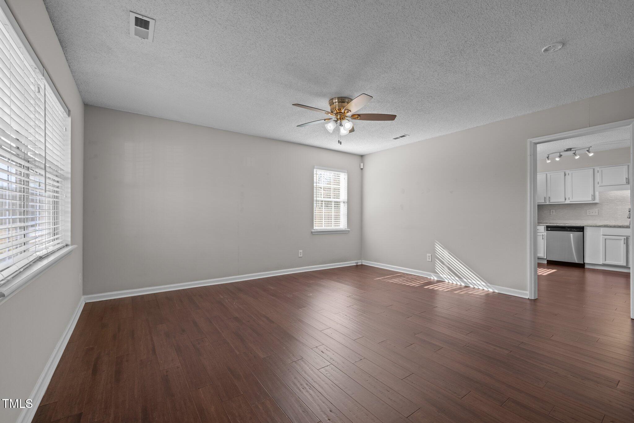 4104 Ludgate Drive Durham, NC 27713 - Photo 18 of 46 an empty room with wooden floor and window