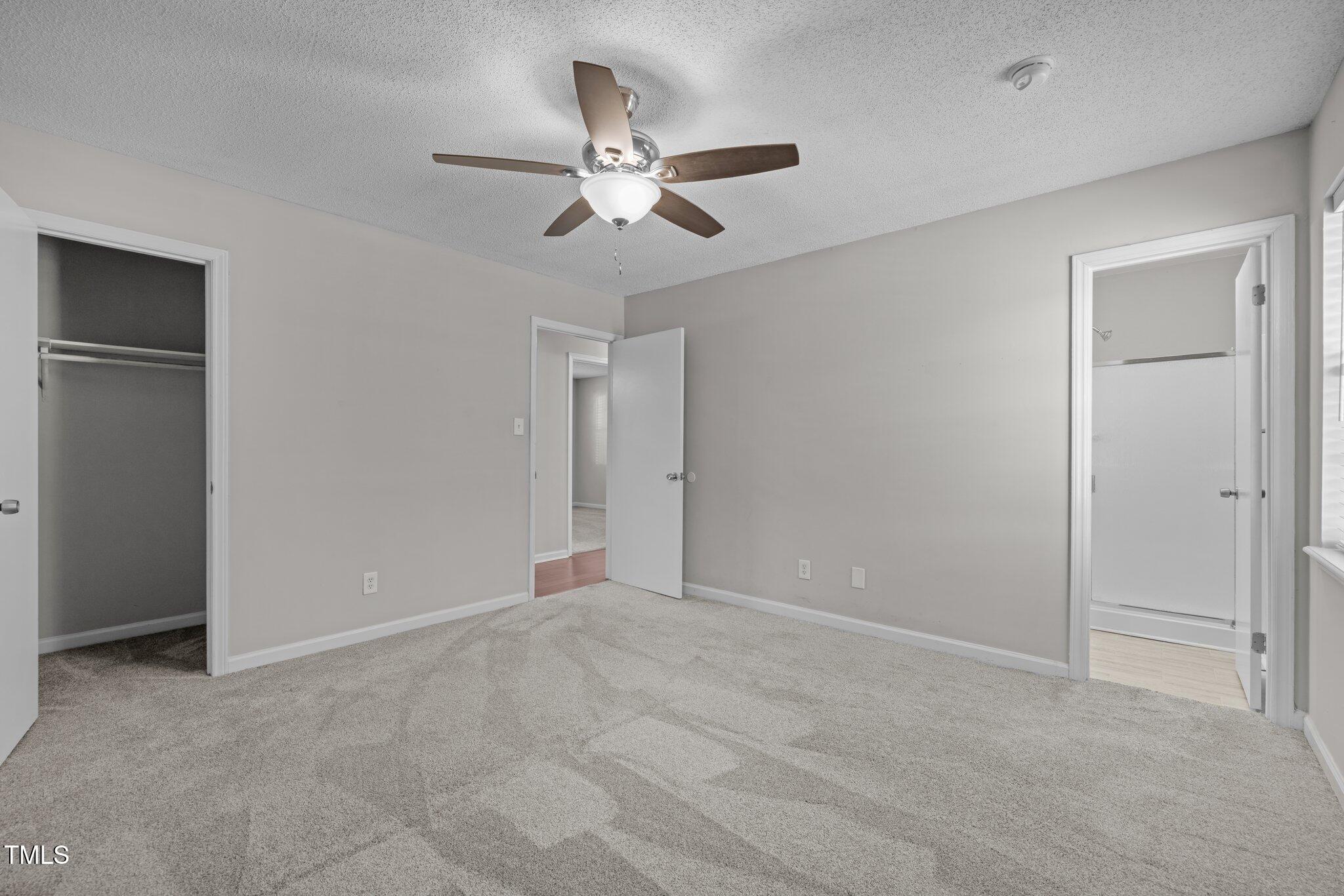 4104 Ludgate Drive Durham, NC 27713 - Photo 26 of 46 a view of an empty room with a ceiling fan