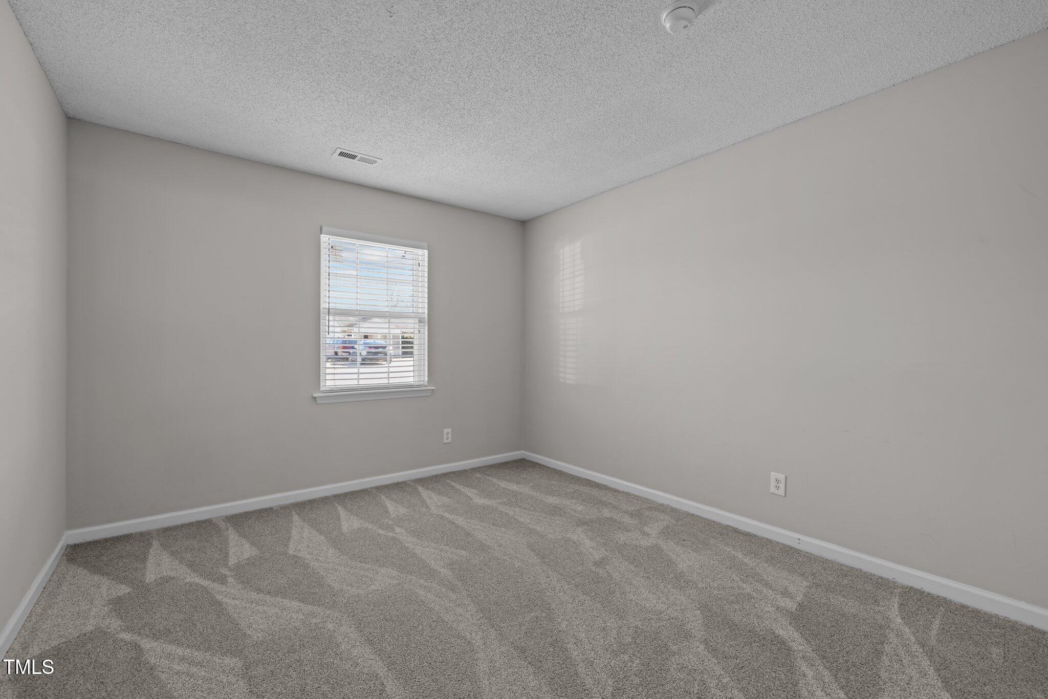 4104 Ludgate Drive Durham, NC 27713 - Photo 30 of 46 an empty room with a window