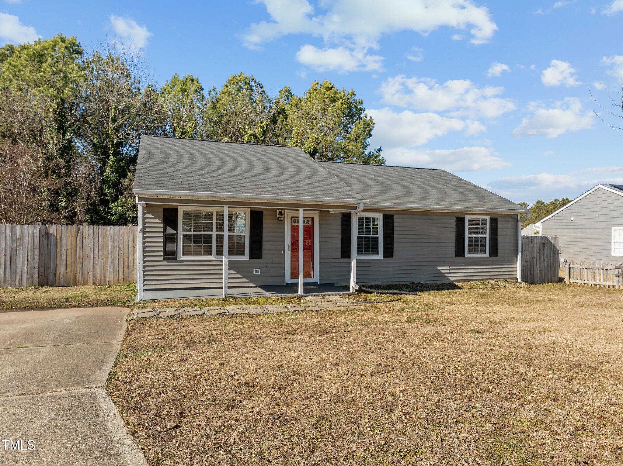 4104 Ludgate Drive Durham, NC 27713 - Photo 3 of 46 a house with trees in the background