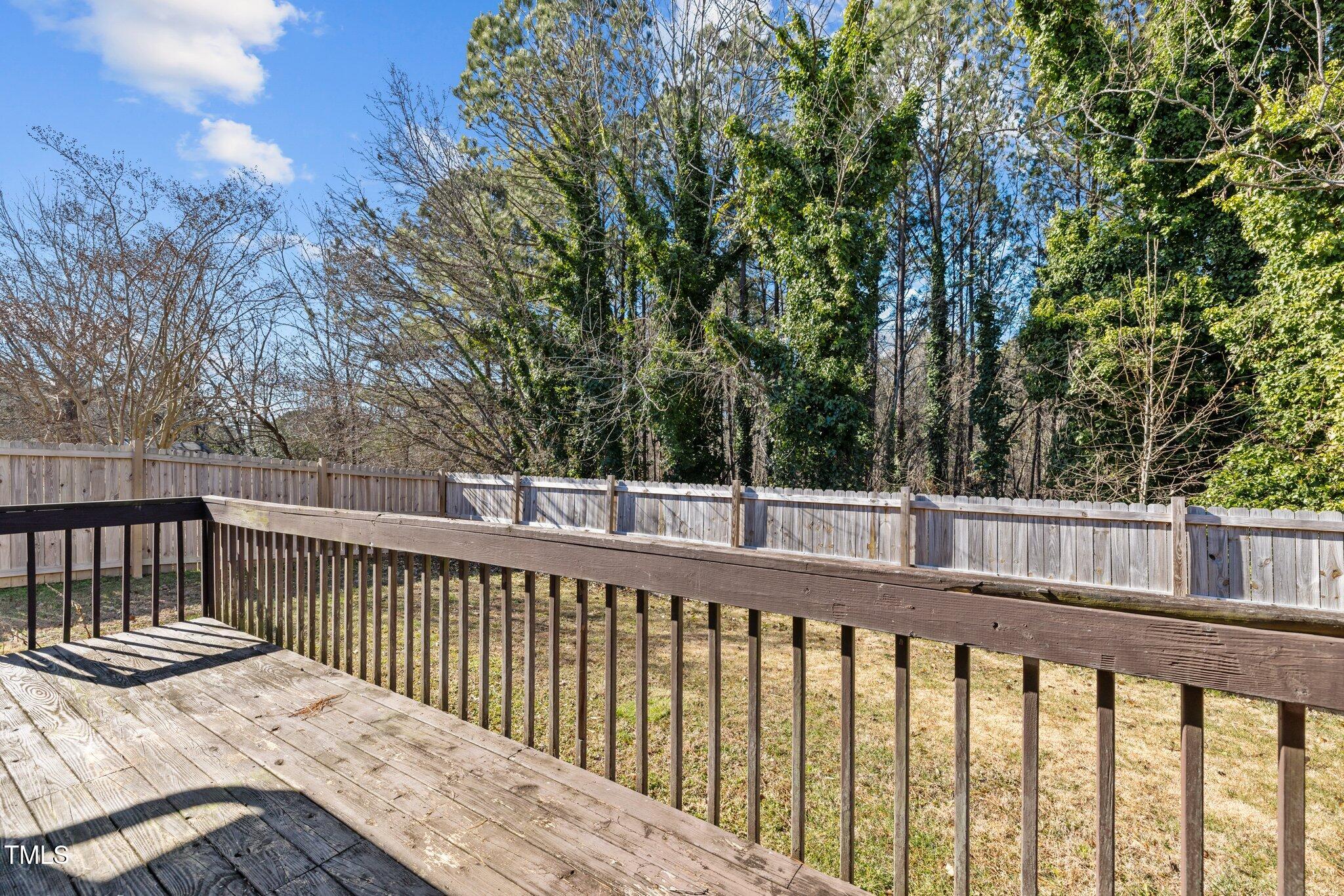 4104 Ludgate Drive Durham, NC 27713 - Photo 35 of 46 a balcony with wooden floor and fence