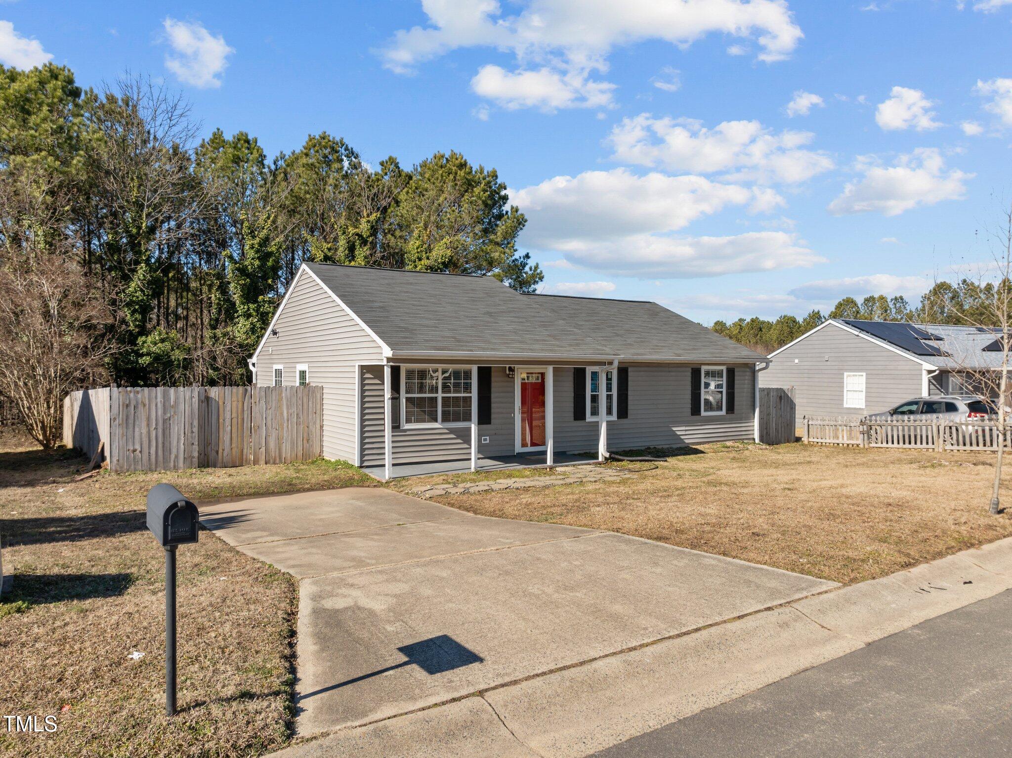 4104 Ludgate Drive Durham, NC 27713 - Photo 4 of 46 a front view of a house with garden