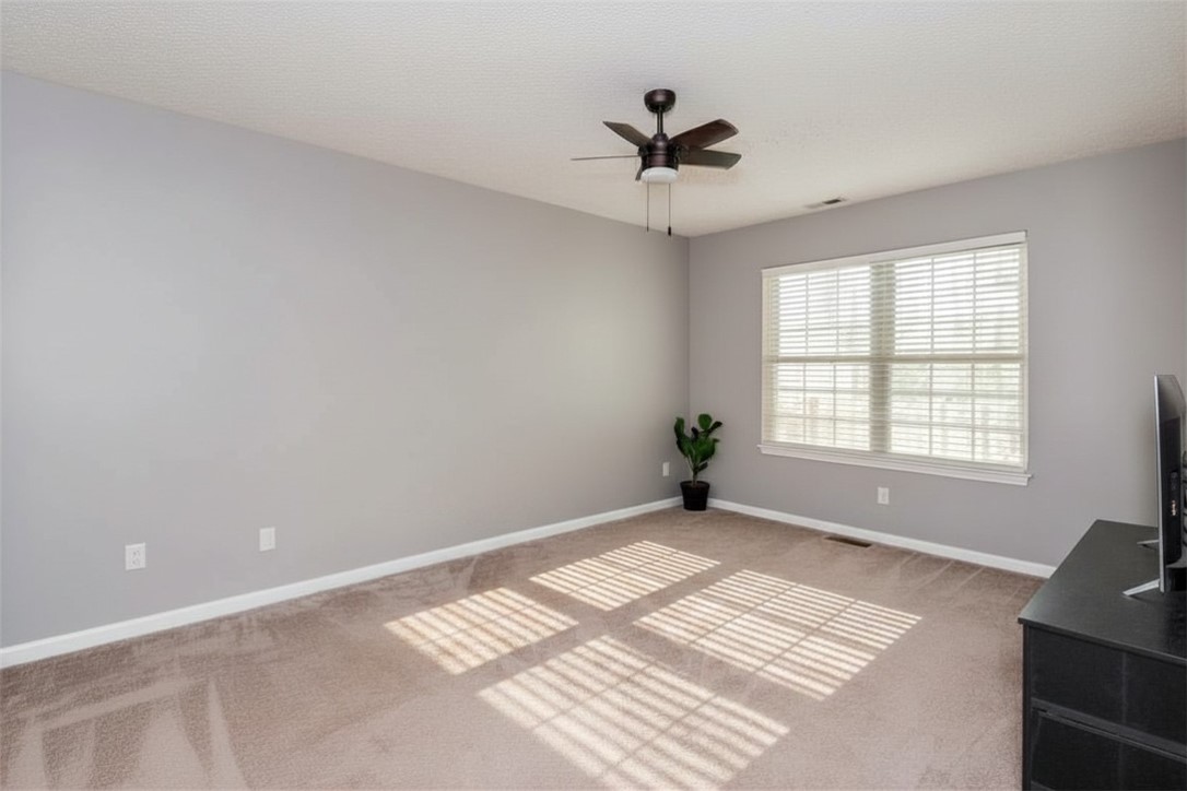 175 Marrett Farm Road Englewood, OH 45322 - Photo 22 of 29 This inviting room features soft carpeting and ample natural light, ideal for peaceful living.