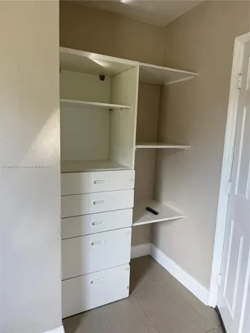 a bathroom with a tub and a window