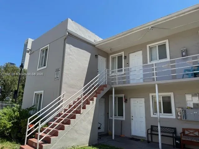 a front view of a house with stairs