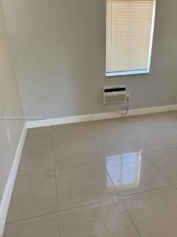 a bathroom with a sink a vanity and a window