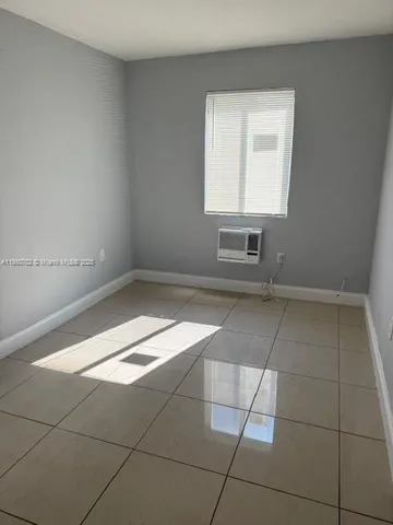a view of empty room with a window