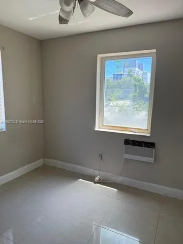a view of storage and utility room with racks on the wall