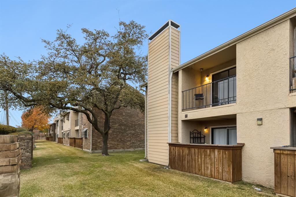 4748 Old Bent Tree Lane, Unit 1808 Dallas, TX 75287 - Photo 22 of 28 a view of a house with a yard