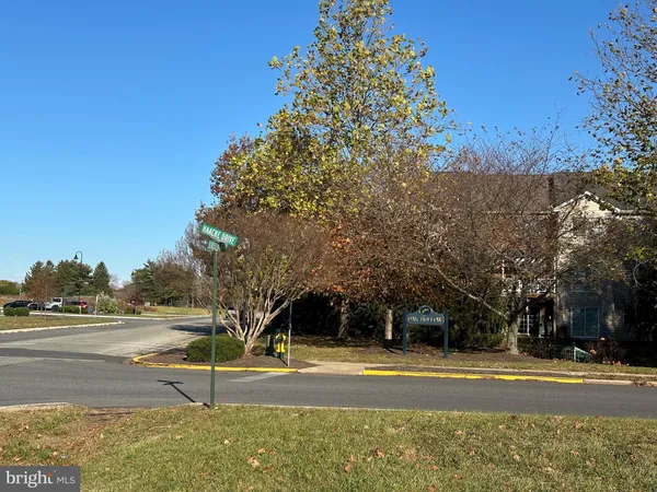 a view of a playground with basketball court