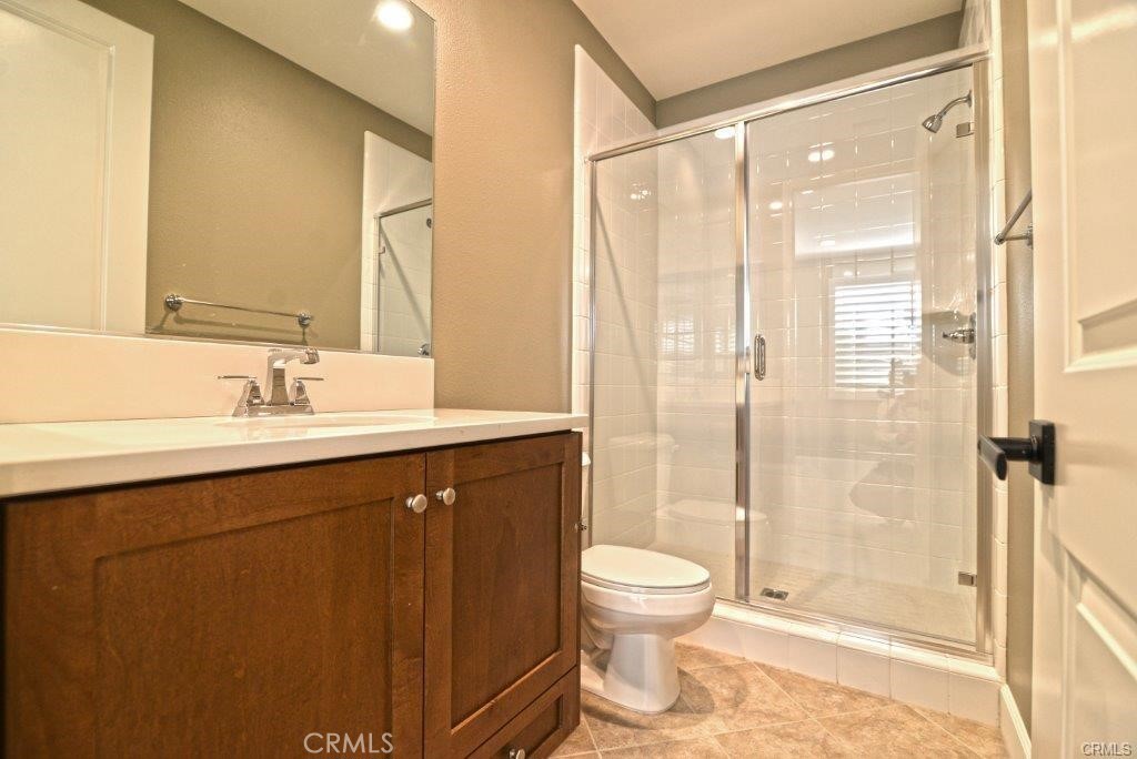 128 Brambles Irvine, CA 92618 - Photo 20 of 27 a bathroom with a sink and a mirror