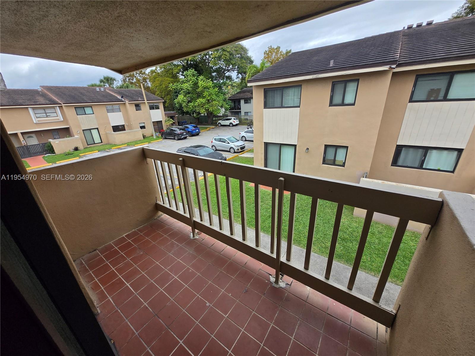 15439 Southwest 80th Street, Unit 2029 Miami, FL 33193 - Photo 7 of 16 a view of a balcony with furniture