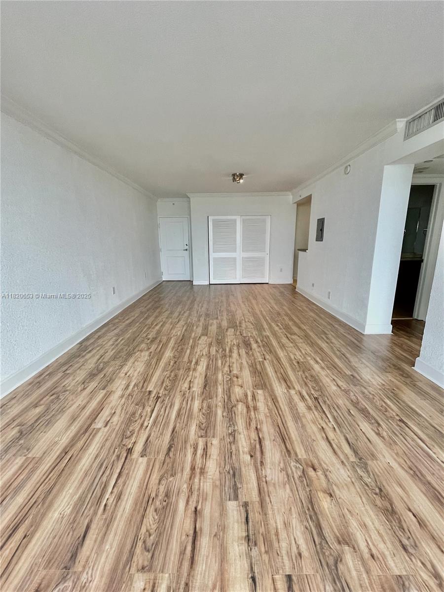401 69th Street, Unit 405 Miami Beach, FL 33141 - Photo 13 of 25 a view of empty room with wooden floor