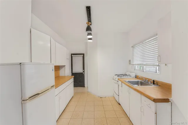 $699,999 | 85-06 122nd Street | Kew Gardens