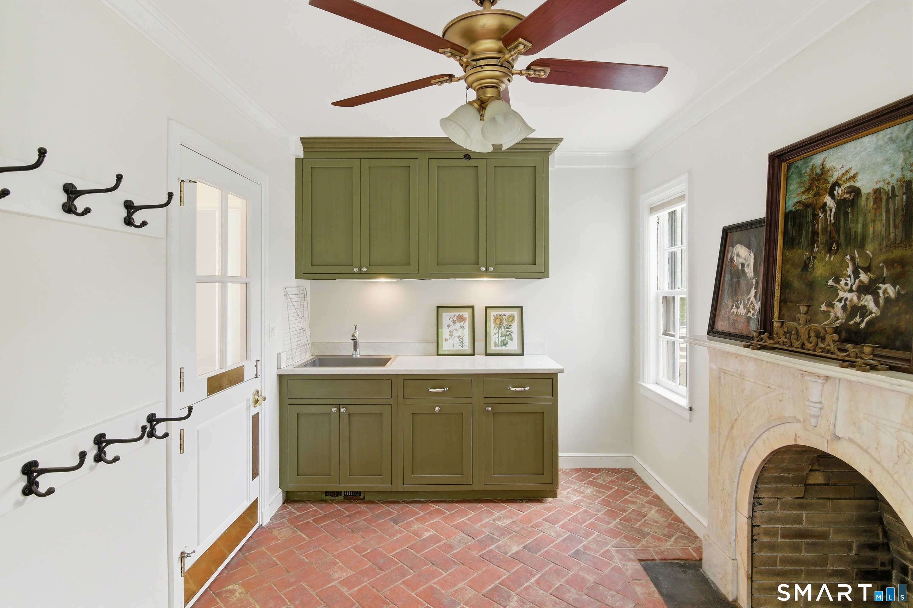433 Wrights Crossing Road Pomfret, CT 06259 - Photo 24 of 36 Another view of the mudroom, with sink and cabinetry. Convenient hooks to hang up outerwear.