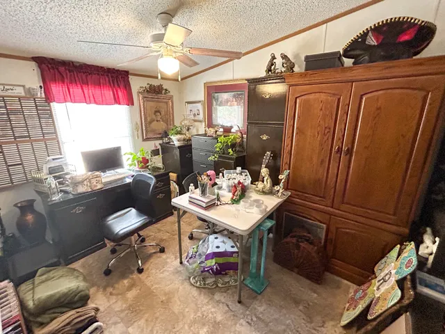 a view of a workspace with furniture