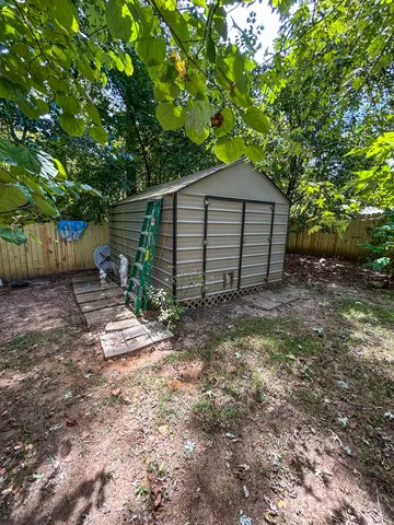 a view of a house with a yard and garage