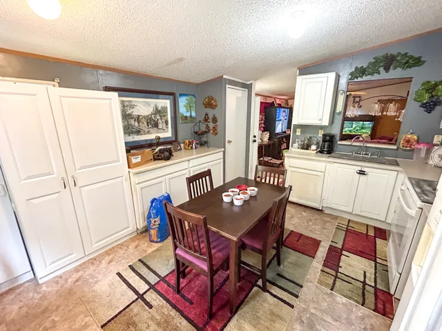 a dining room with furniture and window