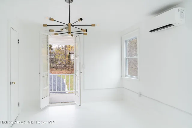 a view of empty room with windows