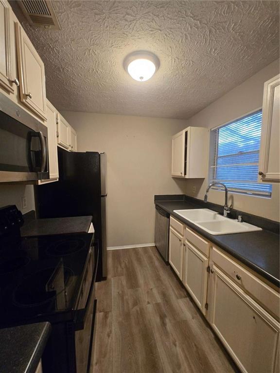 1717 Rondon Court Atlanta, GA 30316 - Photo 5 of 12 a kitchen with stainless steel appliances granite countertop a sink stove and microwave